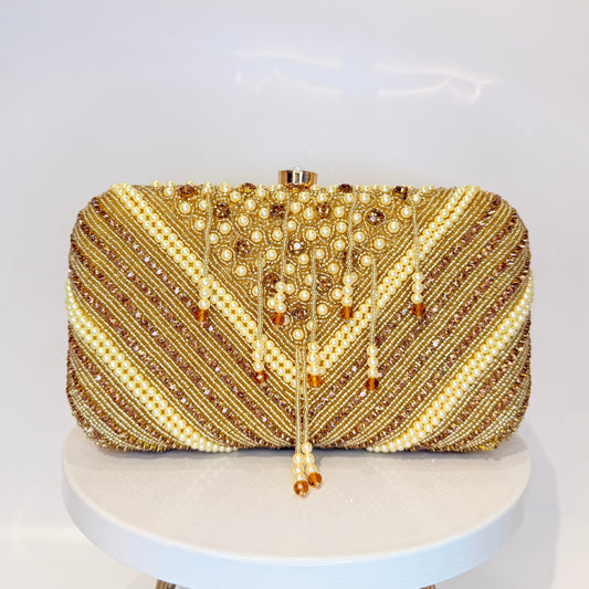 Ivara Tassel Clutch - Golden