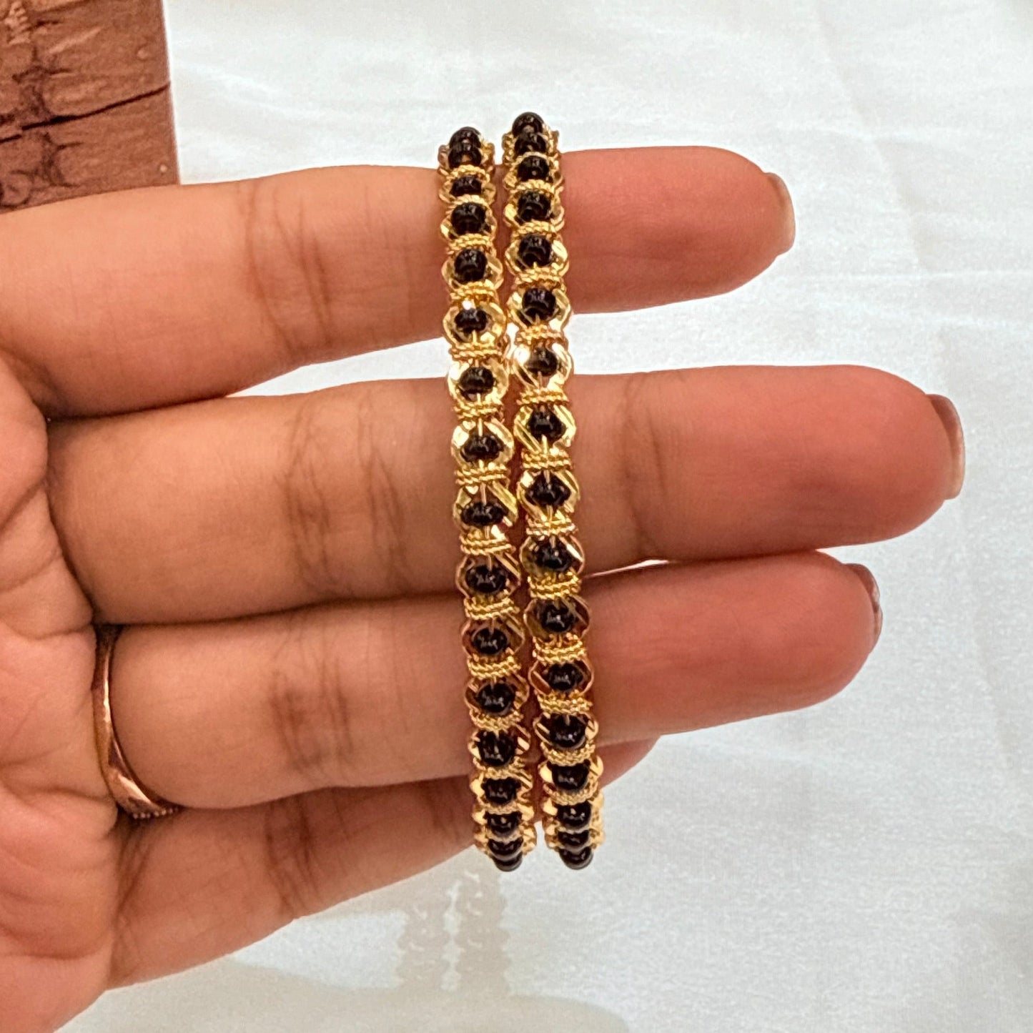 Rashi Black Bead Golden Bangle